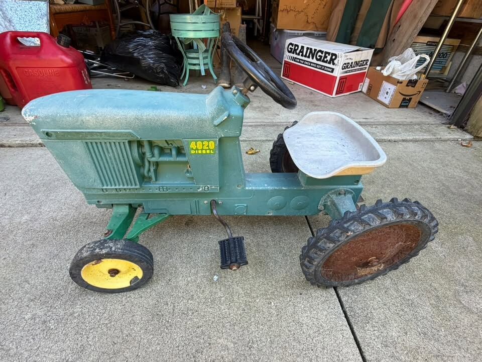 Vintage green pedal tractor collectible